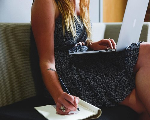 A person working from home with a notebook and a calm setting